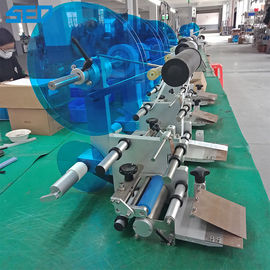 Macchina per l'etichettatura automatica delle bottiglie con adesivo multifunzionale
